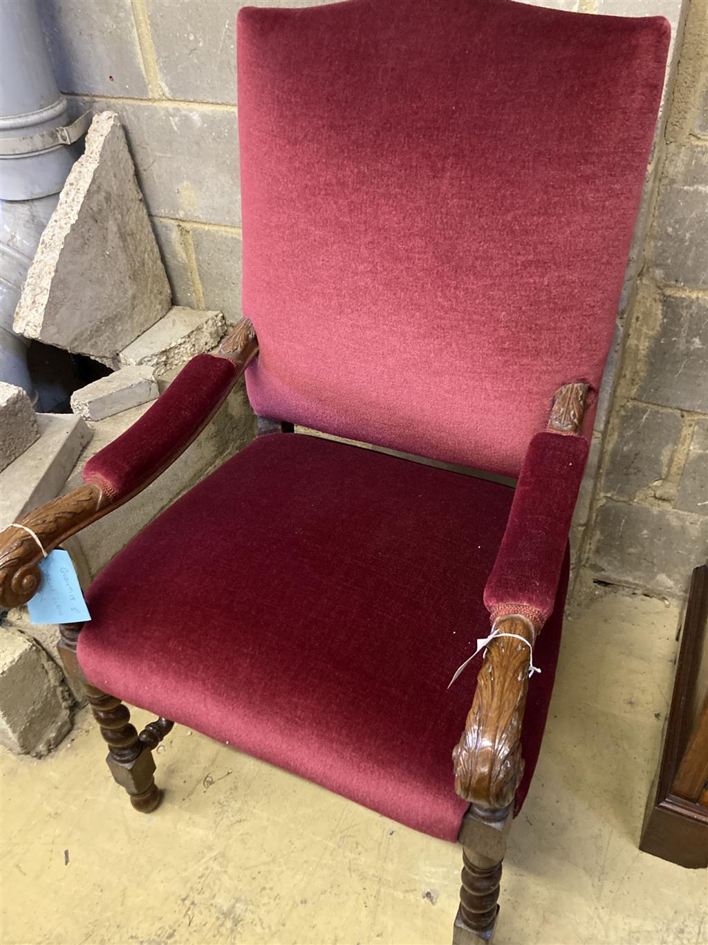A carved oak Carolean design elbow chair, width 64cm, depth 70cm, height 110cm